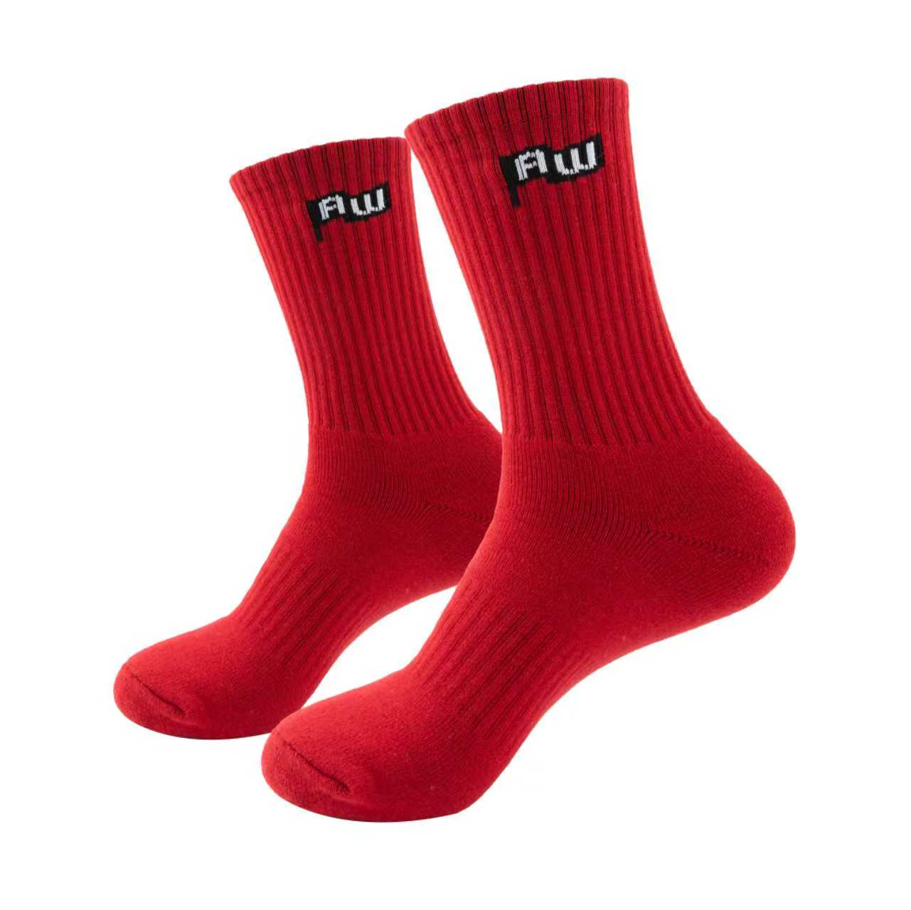 Two red socks with a logo on a white background