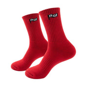 Two red socks with a logo on a white background